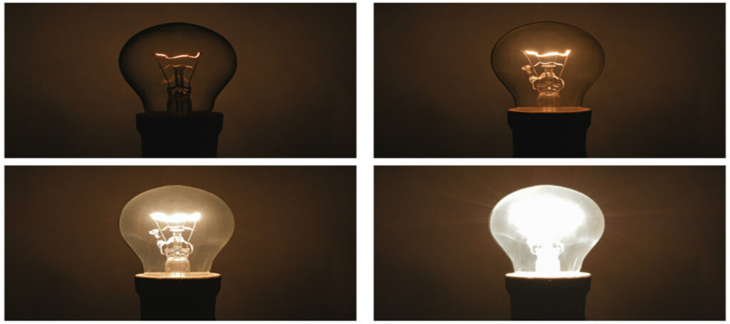 Four light bulbs showing stages of dimming