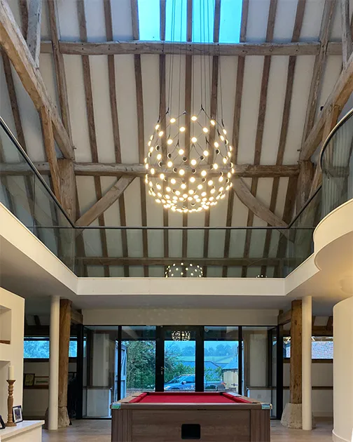 Contemporary chandelier in a converted barn